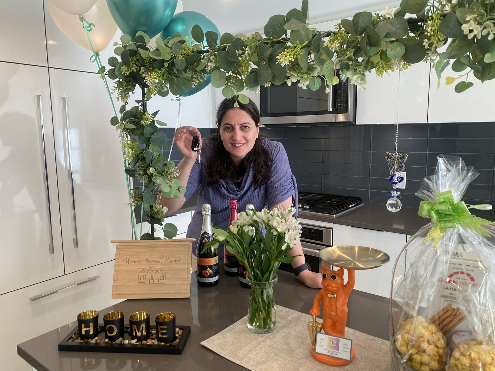 House warming table setup with flowers and refreshments